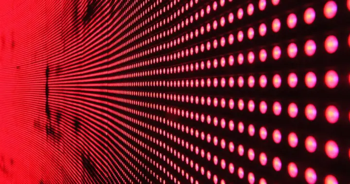 An image of red light-emitting diodes on a screen panel used for an article that describes the pros and cons of Mini-LED display technology.